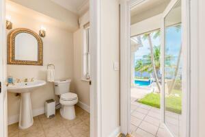 901 Southeast Riverside Drive Stuart, FL 34994 - Photo 46 of 53 a bathroom with a sink toilet and a shower