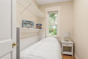 901 Southeast Riverside Drive Stuart, FL 34994 - Photo 53 of 53 a bedroom with a bed and a window