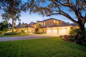 901 Southeast Riverside Drive Stuart, FL 34994 - Photo 10 of 53 a view of a house with a big yard