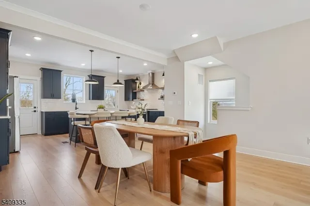 a view of kitchen with cabinets table and chairs