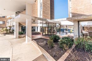 1836 Metzerott Road, Unit 222 Hyattsville, MD 20783 - Photo 1 of 16 a view of a building with a porch