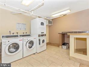 1836 Metzerott Road, Unit 222 Hyattsville, MD 20783 - Photo 13 of 16 a utility room with dryer and washer