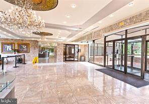 1836 Metzerott Road, Unit 222 Hyattsville, MD 20783 - Photo 4 of 16 a view of an entryway with a floor to ceiling window