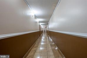 1836 Metzerott Road, Unit 222 Hyattsville, MD 20783 - Photo 5 of 16 a view of a hallway with wooden floor