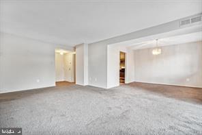 1836 Metzerott Road, Unit 222 Hyattsville, MD 20783 - Photo 6 of 16 an empty room with a natural light