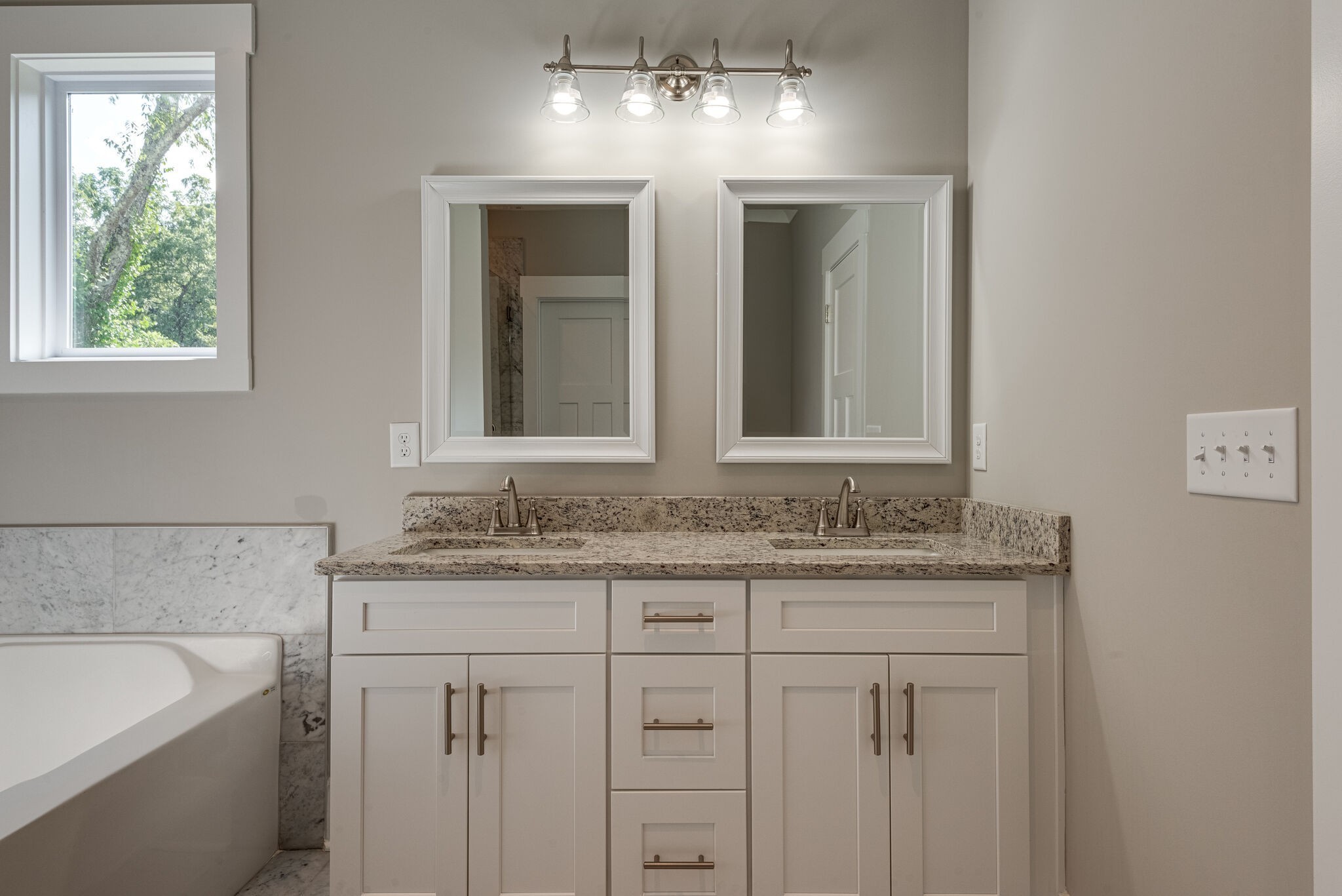 7163 Pepper Tree Circle Fairview, TN 37062 - Photo 21 of 30 a bathroom with a granite countertop sink and a mirror