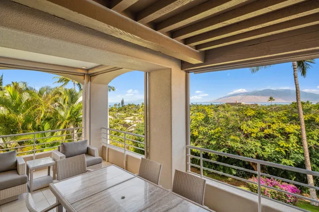 a dining room with furniture and a floor to ceiling window