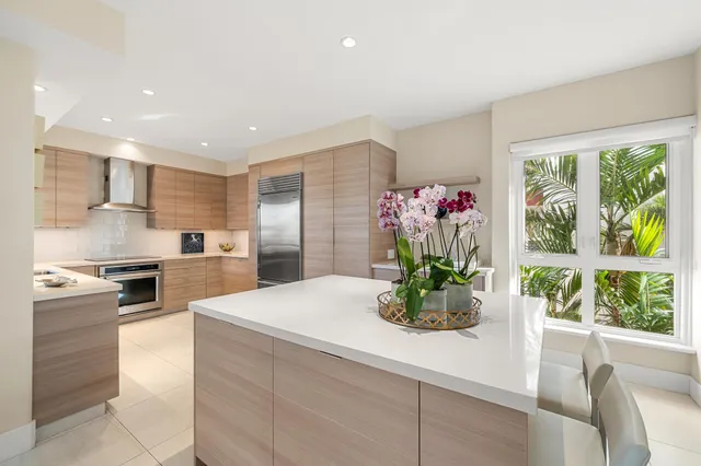 a kitchen with a refrigerator and sink