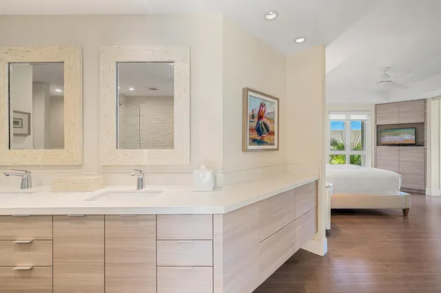 a bathroom with a sink double vanity and a mirror