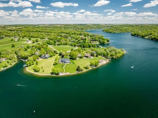 a view of a lake with a house in the background