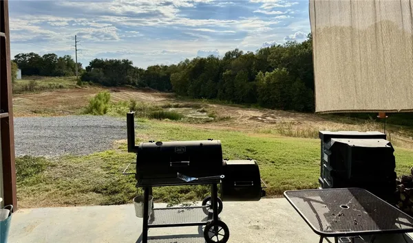 a view of a lake with a yard