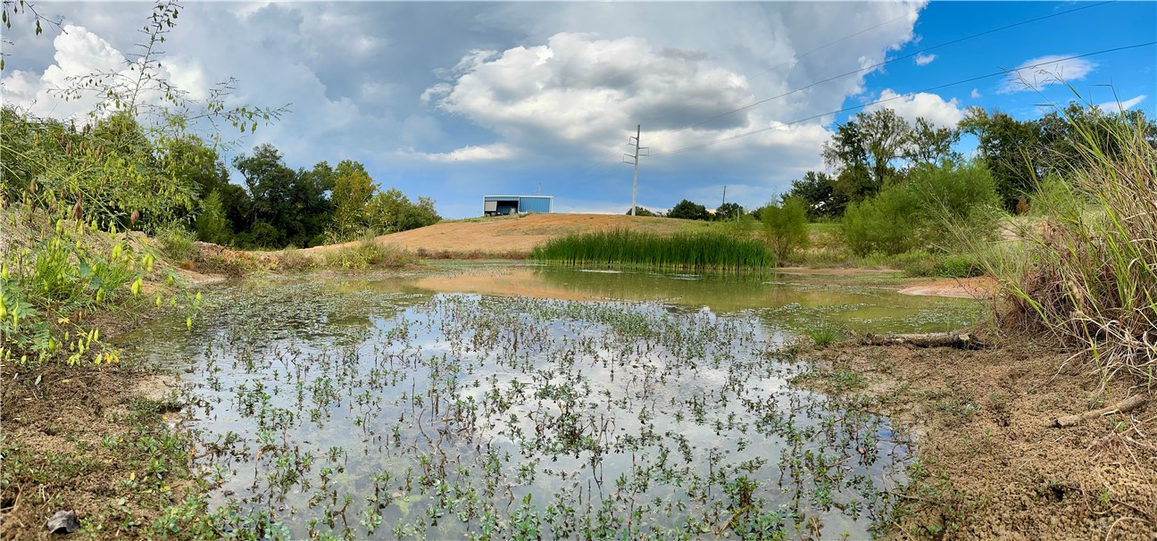 967 Little Mississippi Cemetery Road, Unit COUNTYROAD Franklin, TX 77856 - Photo 13 of 27 a view of a lake with a yard