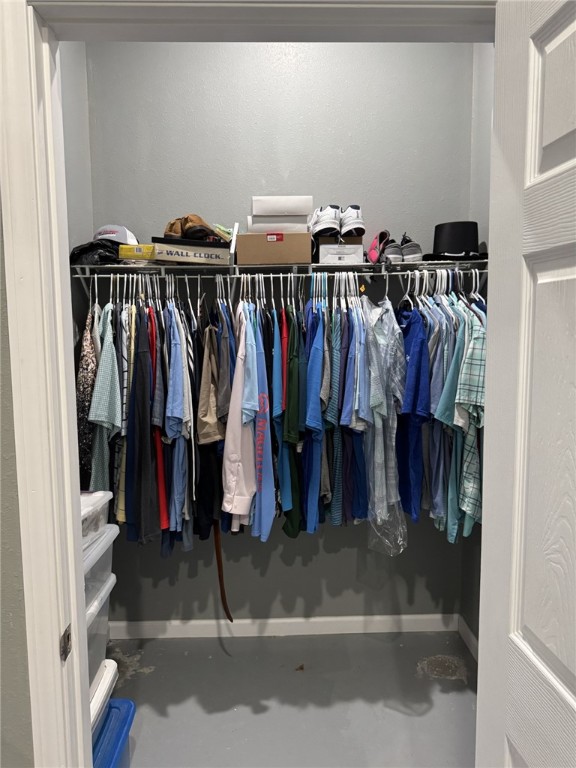 967 Little Mississippi Cemetery Road, Unit COUNTYROAD Franklin, TX 77856 - Photo 19 of 27 a view of walk in closet with clothes