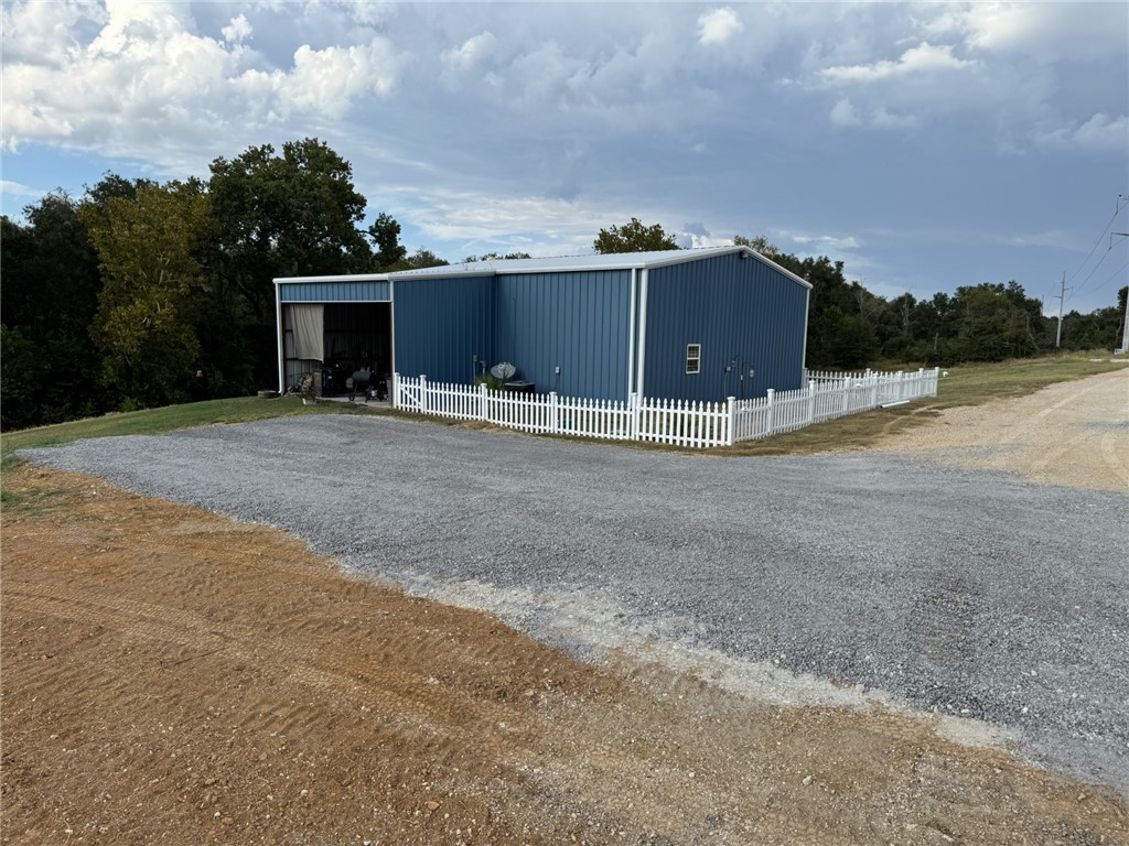 967 Little Mississippi Cemetery Road, Unit COUNTYROAD Franklin, TX 77856 - Photo 2 of 27 a front view of a house with a yard and garage