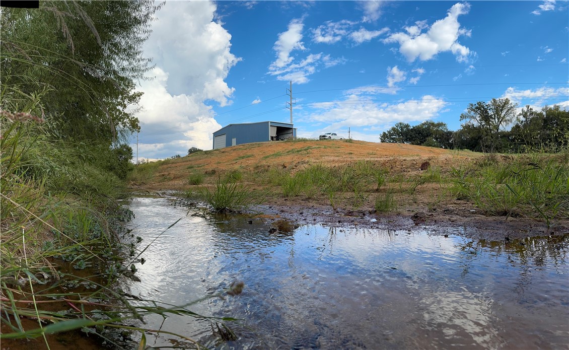967 Little Mississippi Cemetery Road, Unit COUNTYROAD Franklin, TX 77856 - Photo 3 of 27 a view of a lake with beach