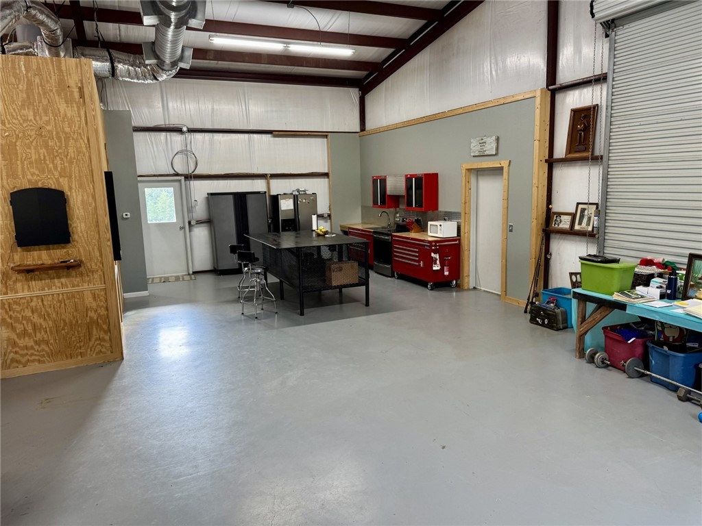 967 Little Mississippi Cemetery Road, Unit COUNTYROAD Franklin, TX 77856 - Photo 9 of 27 a living room with furniture and a flat screen tv