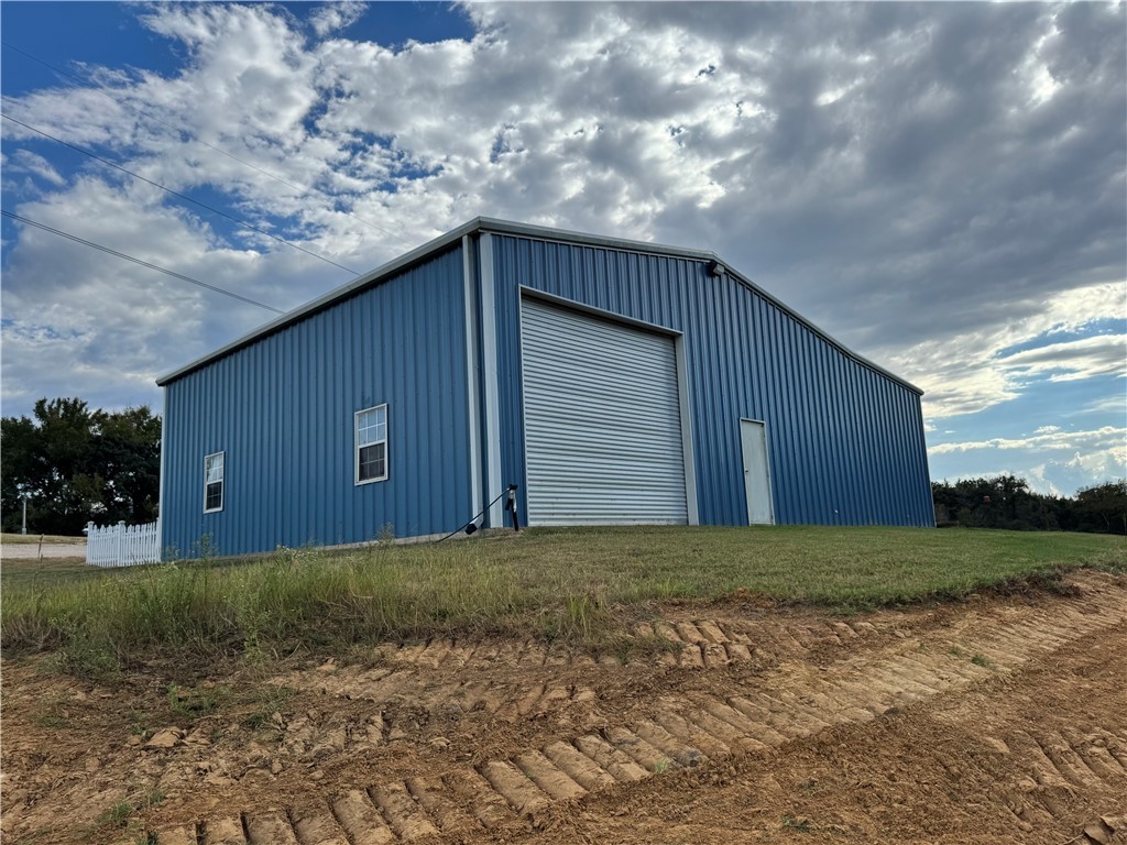 967 Little Mississippi Cemetery Road, Unit COUNTYROAD Franklin, TX 77856 - Photo 10 of 27 a house with trees in the background