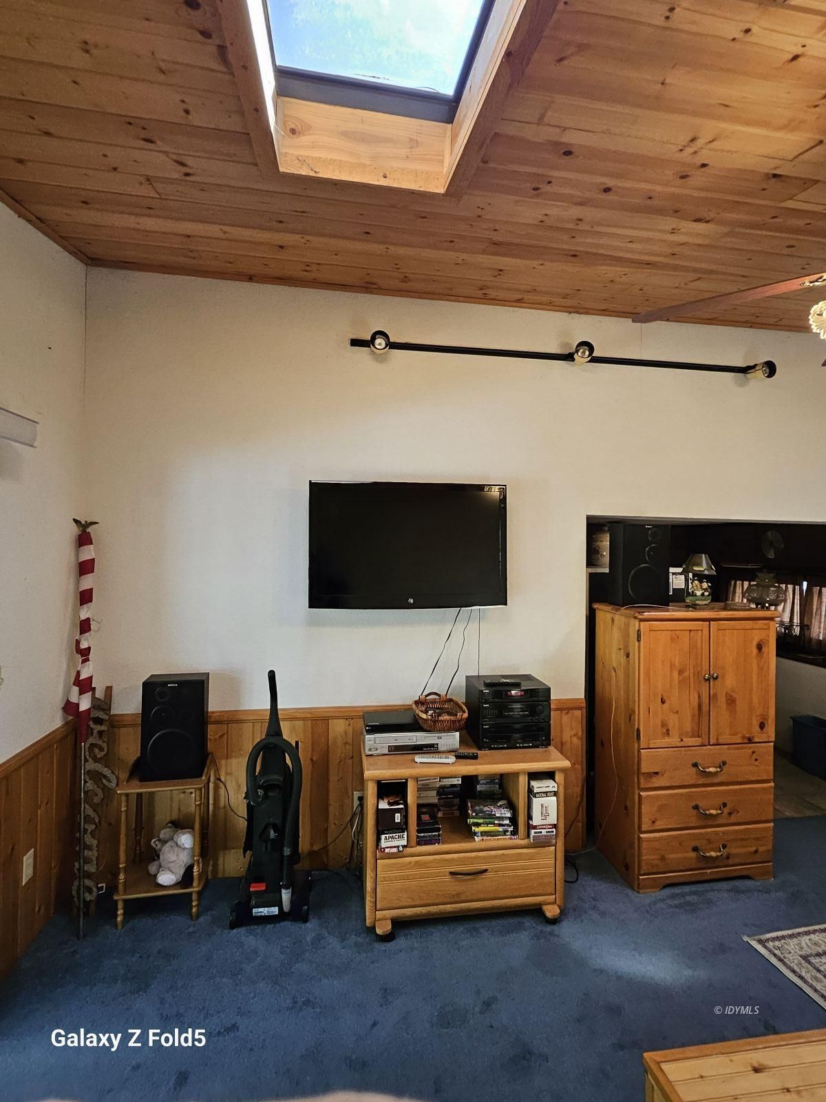 25955 Highway 243, Unit 40 Idyllwild, CA 92549 - Photo 13 of 32 a room with furniture and a flat screen tv