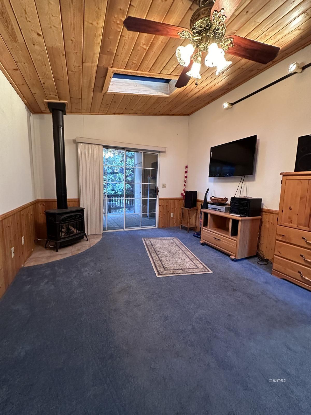25955 Highway 243, Unit 40 Idyllwild, CA 92549 - Photo 19 of 32 a living room with furniture and a flat screen tv