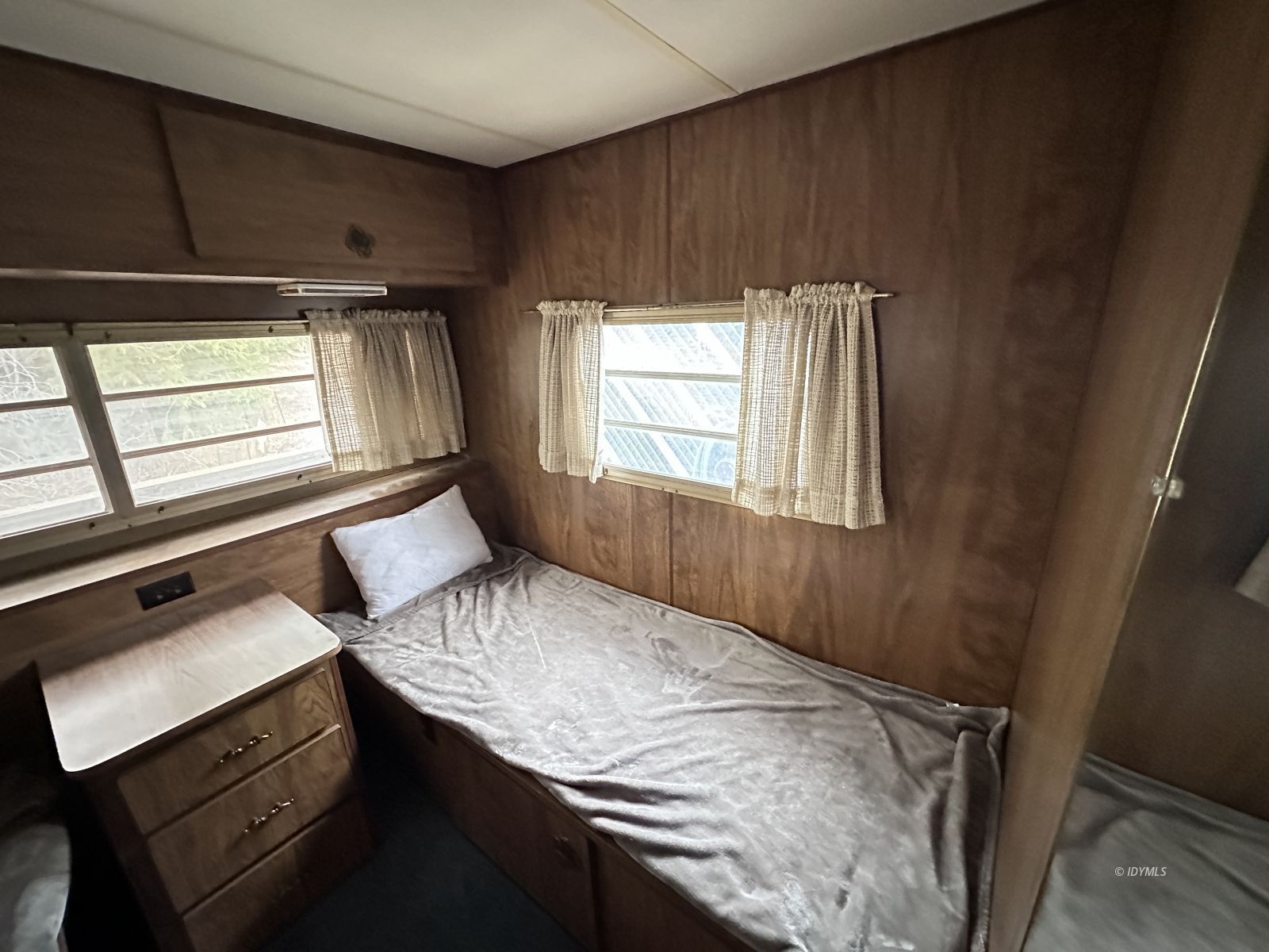 25955 Highway 243, Unit 40 Idyllwild, CA 92549 - Photo 26 of 32 a bedroom with a bed and a window