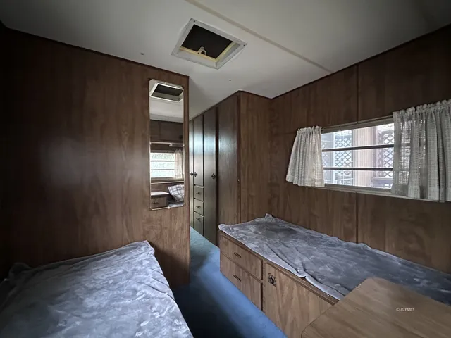 a kitchen with kitchen island stainless steel appliances a sink stove and refrigerator