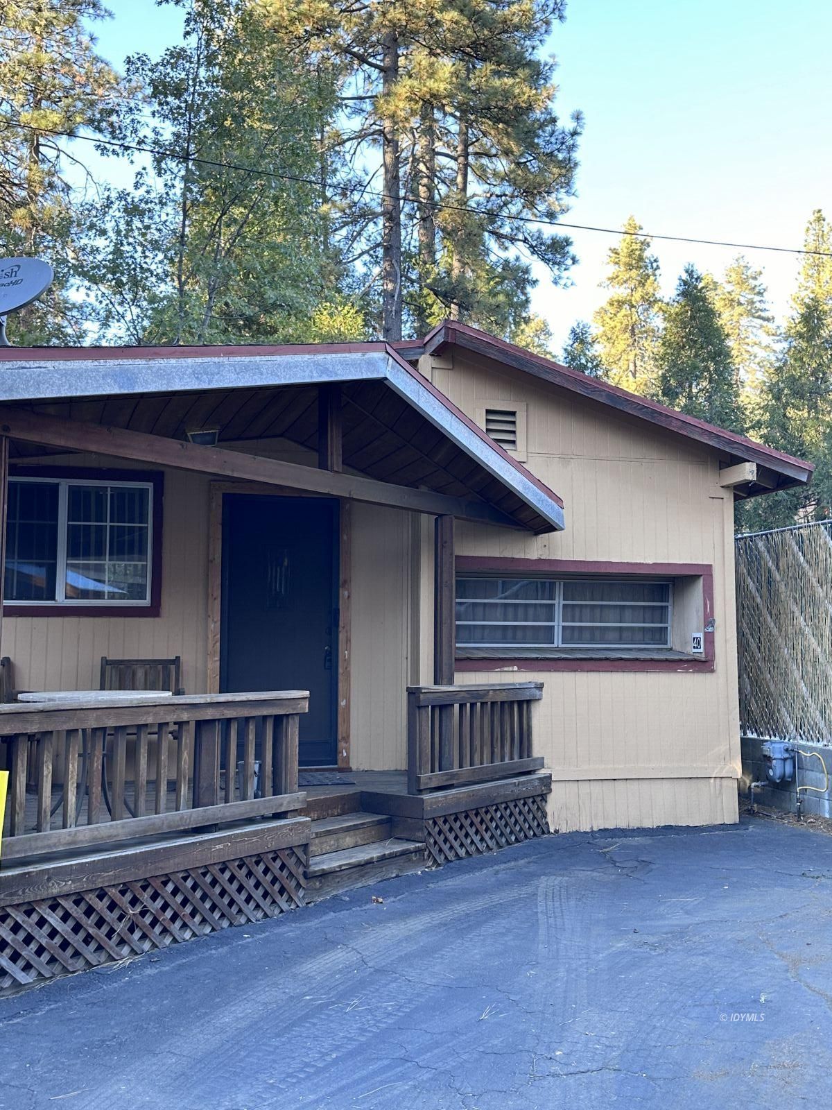 25955 Highway 243, Unit 40 Idyllwild, CA 92549 - Photo 32 of 32 a view of house with a yard and wooden fence