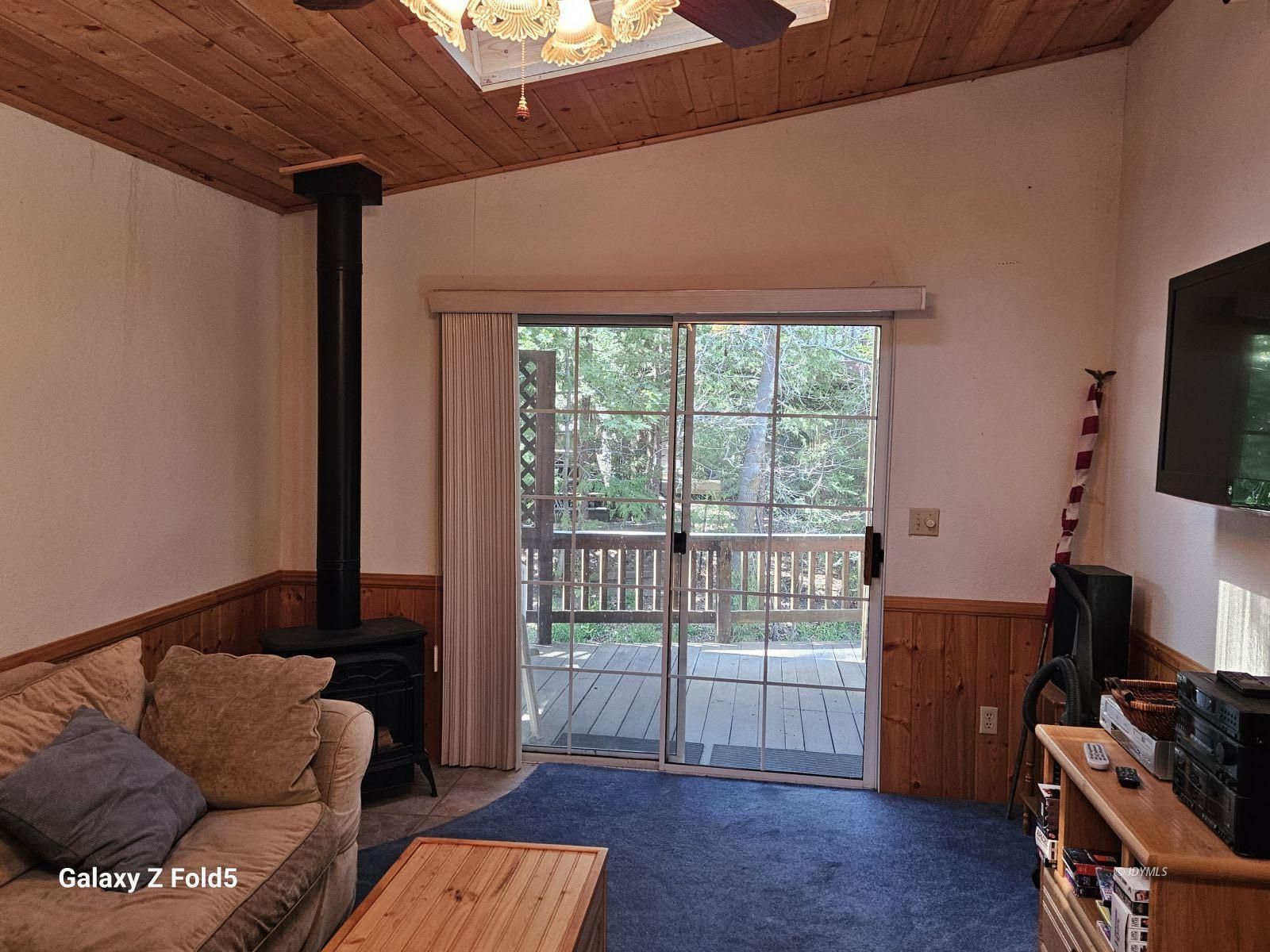 25955 Highway 243, Unit 40 Idyllwild, CA 92549 - Photo 4 of 32 a living room with furniture and a flat screen tv