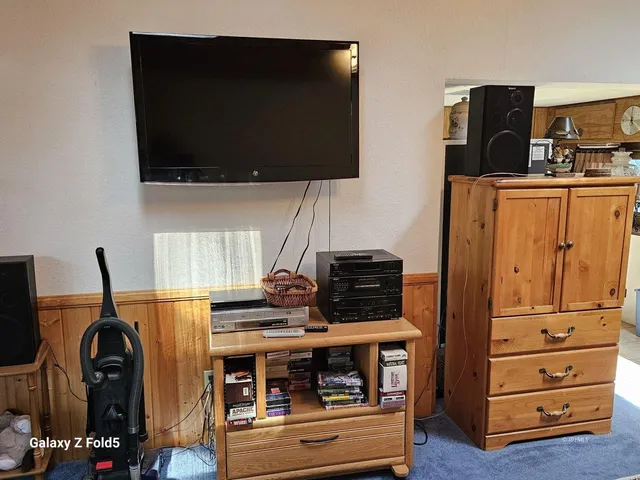 a kitchen with stainless steel appliances a stove and a microwave