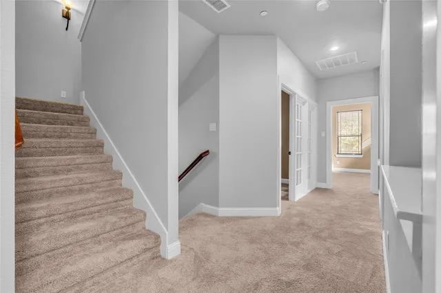 a view of a hallway with closet