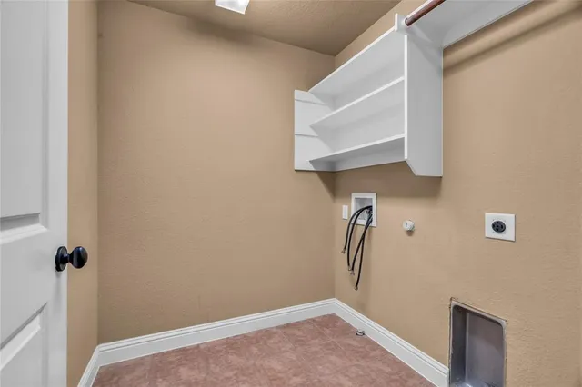 a bathroom with a granite countertop sink and a large mirror
