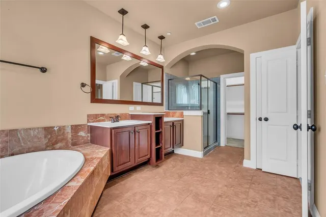 a view of an empty room with glass door