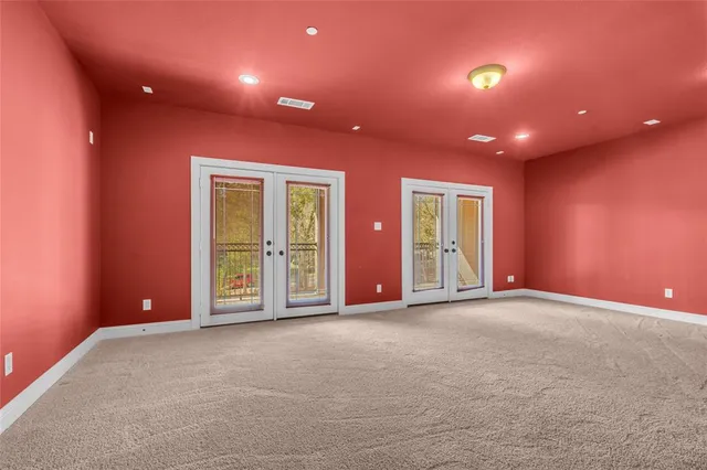 a bathroom with a granite countertop sink a toilet and a mirror