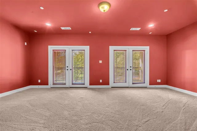 a view of a backyard with a iron fence