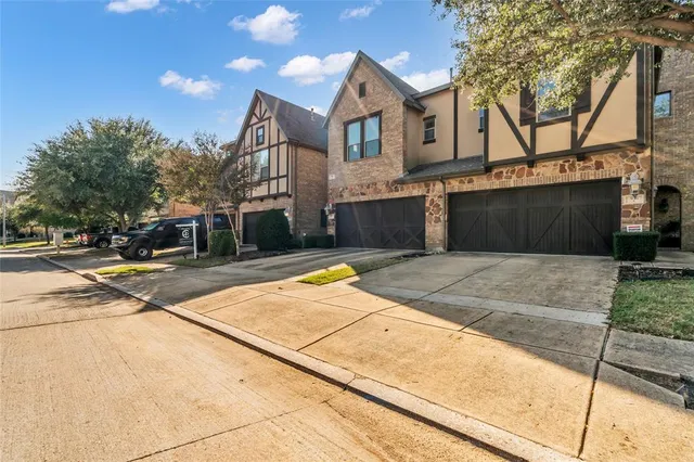 a view of a house with cars park