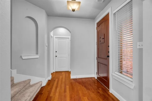 a view of kitchen with sink microwave and refrigerator
