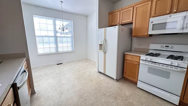a large kitchen with a window