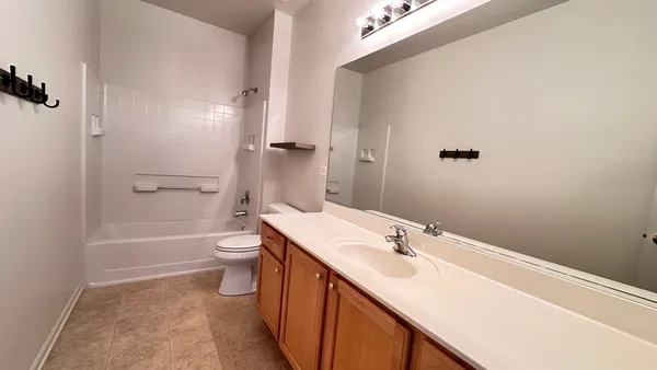 a bathroom with a tub and a shower
