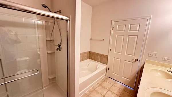 a bathroom with a sink double vanity and a mirror