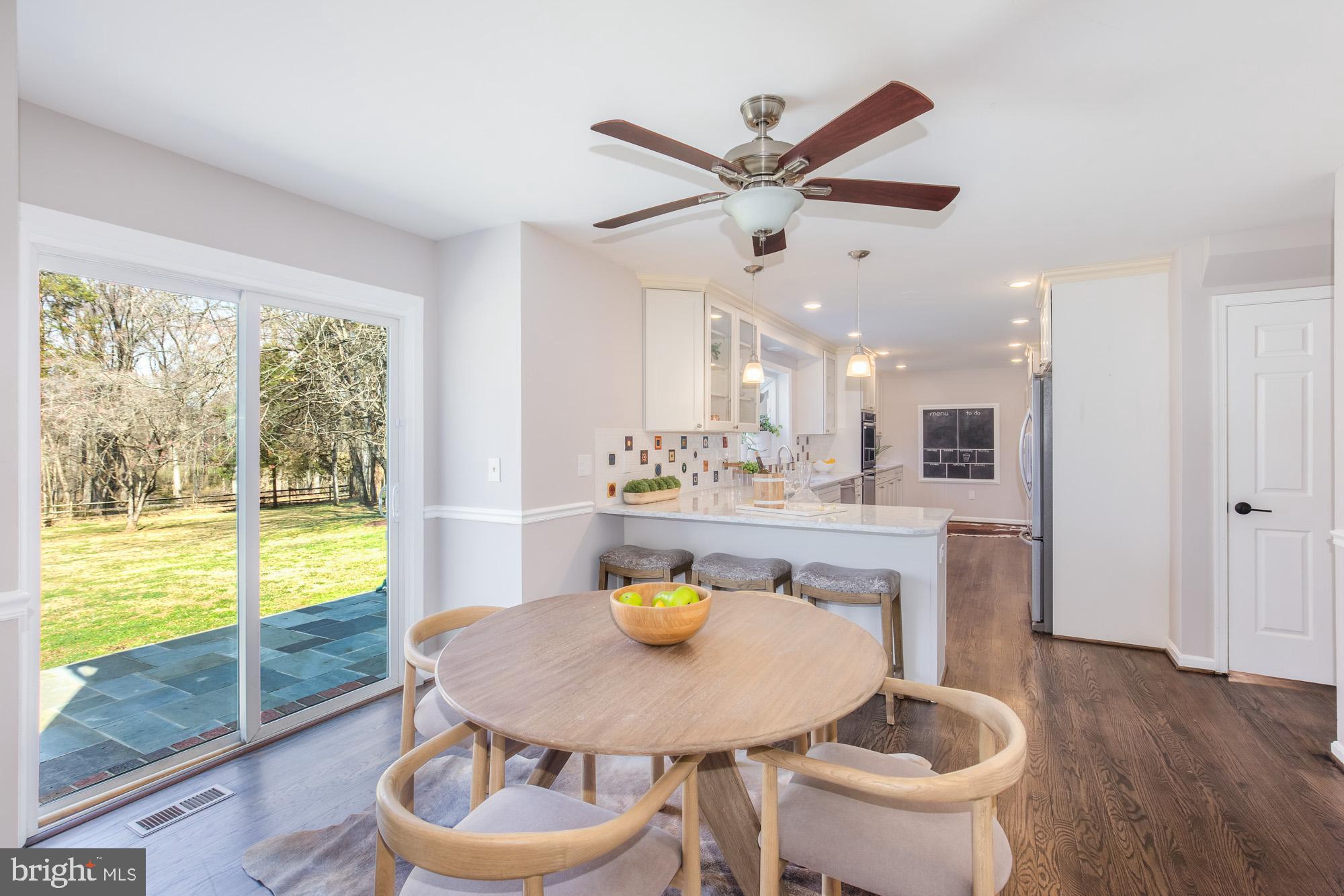 16217 Whitehaven Road Silver Spring, MD 20906 - Photo 15 of 50 a kitchen with a table and chairs in it