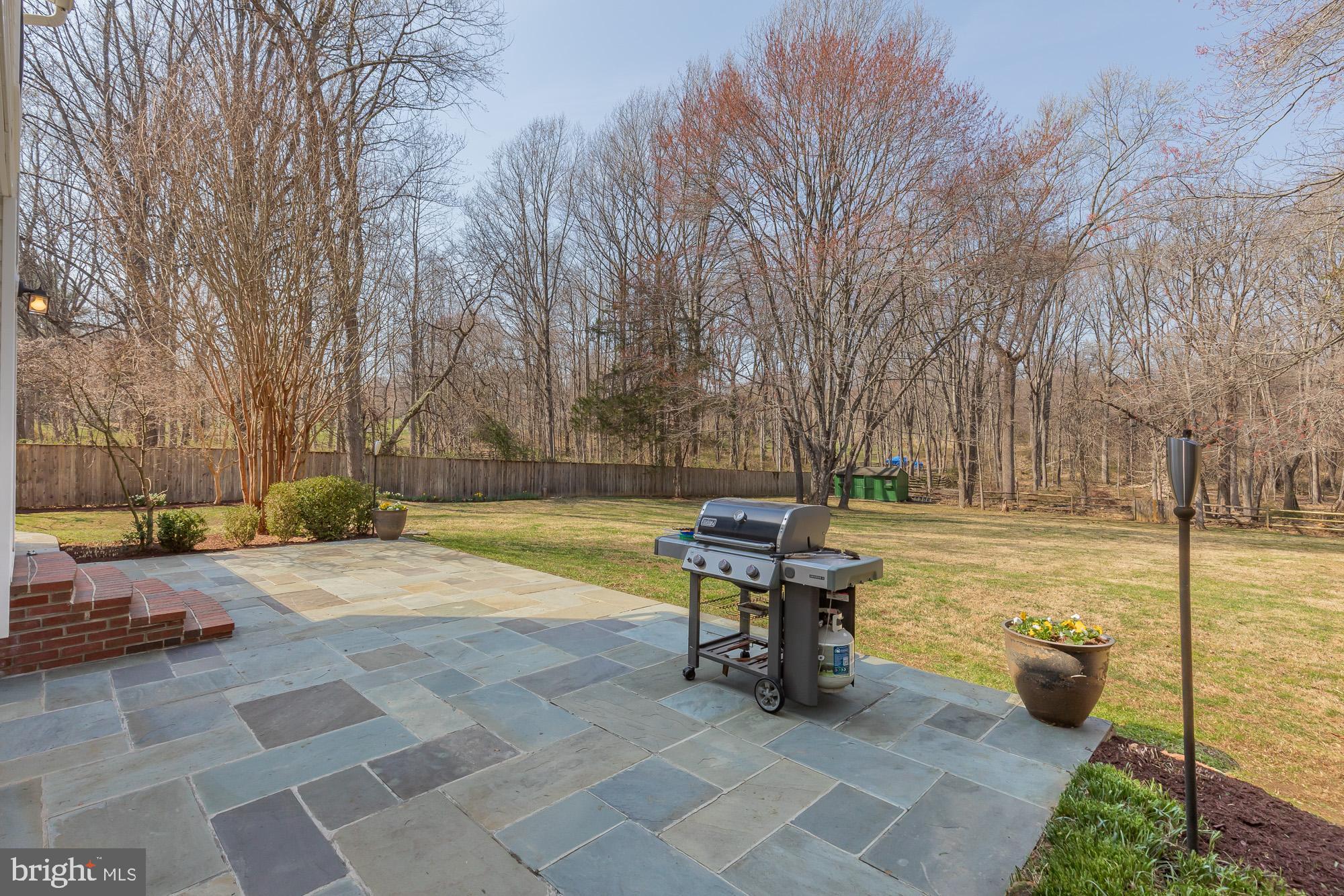 16217 Whitehaven Road Silver Spring, MD 20906 - Photo 19 of 50 a view of a swimming pool with two chairs in a patio