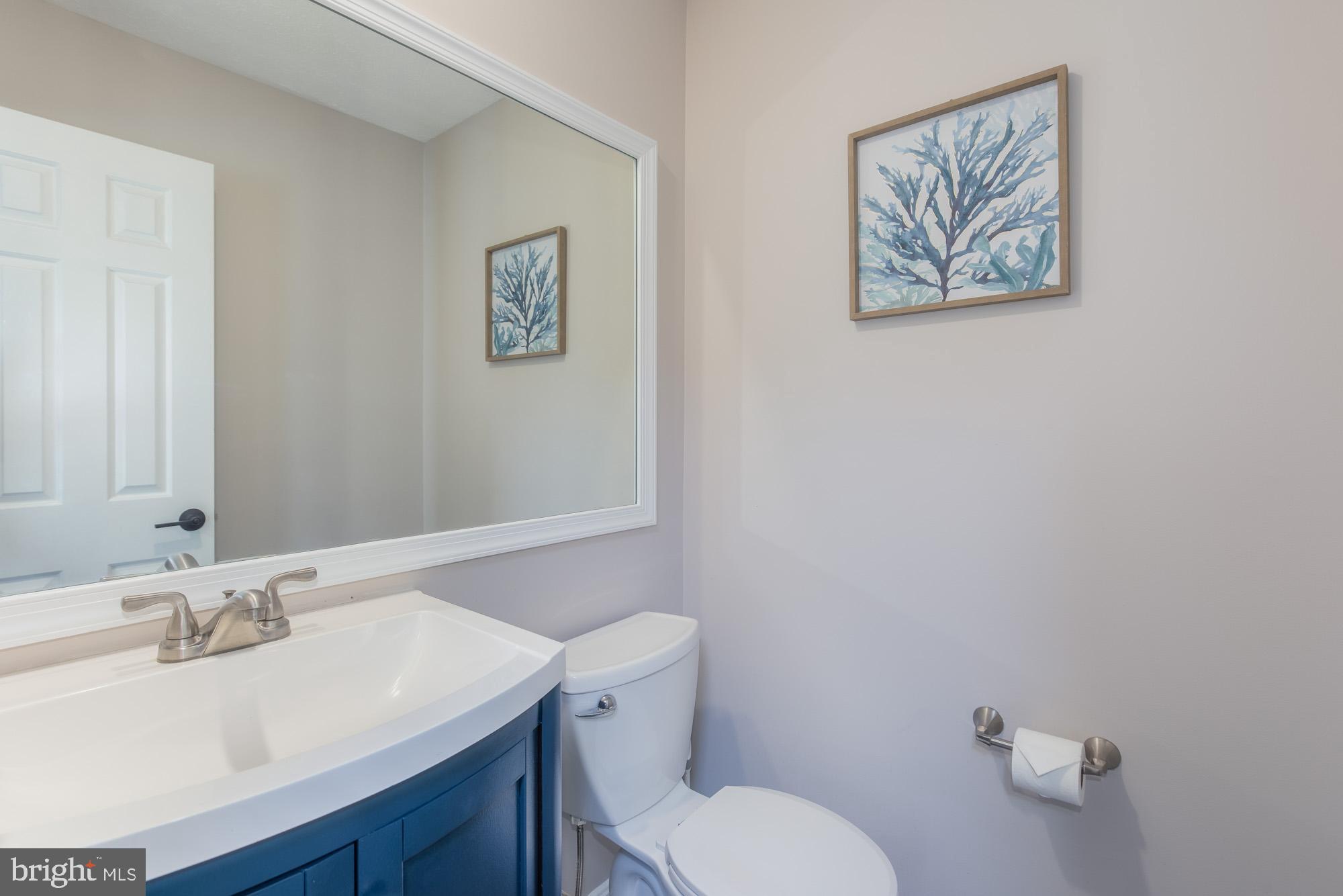 16217 Whitehaven Road Silver Spring, MD 20906 - Photo 25 of 50 a bathroom with a toilet sink and mirror