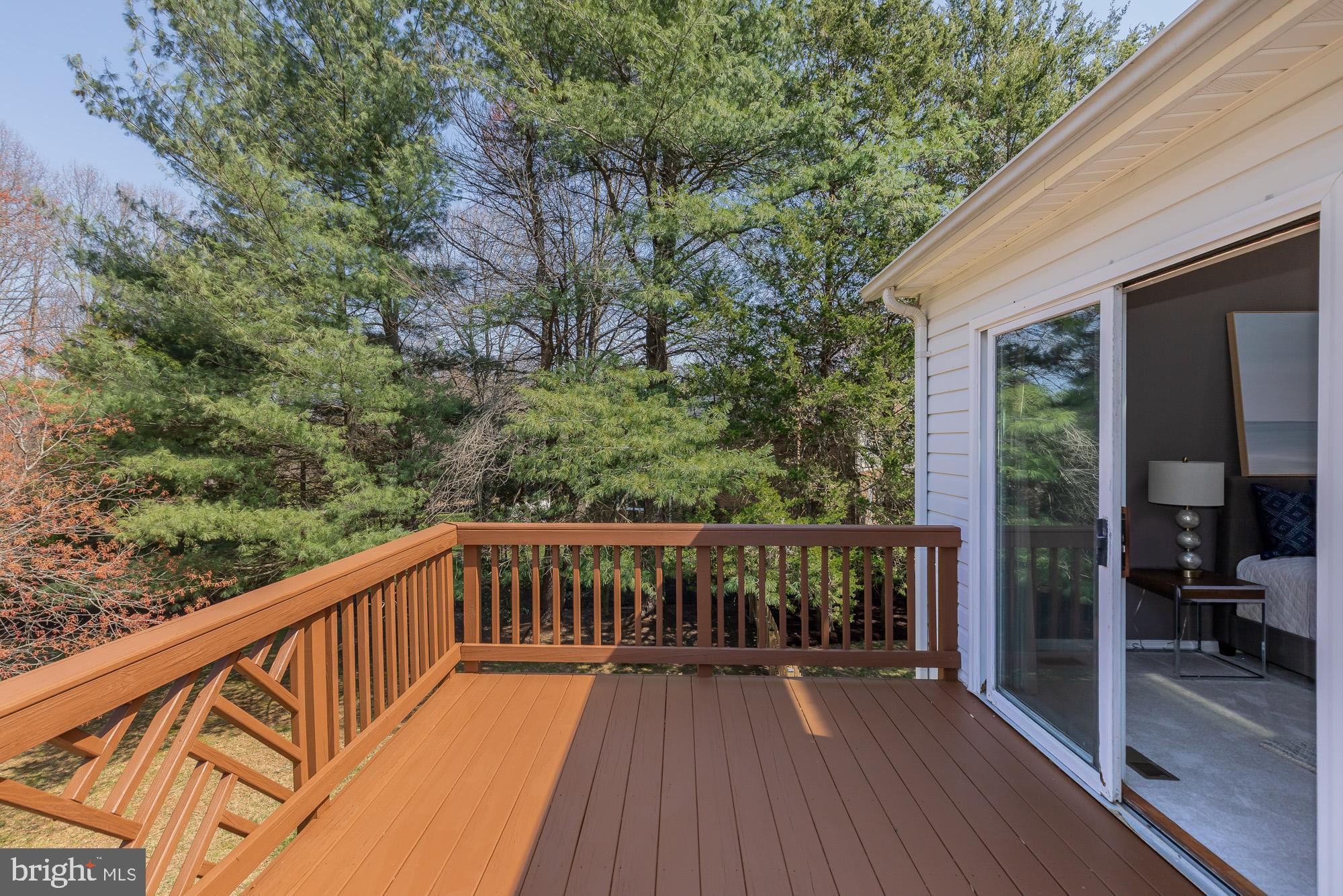 16217 Whitehaven Road Silver Spring, MD 20906 - Photo 28 of 50 a balcony with wooden floor and yard in the back