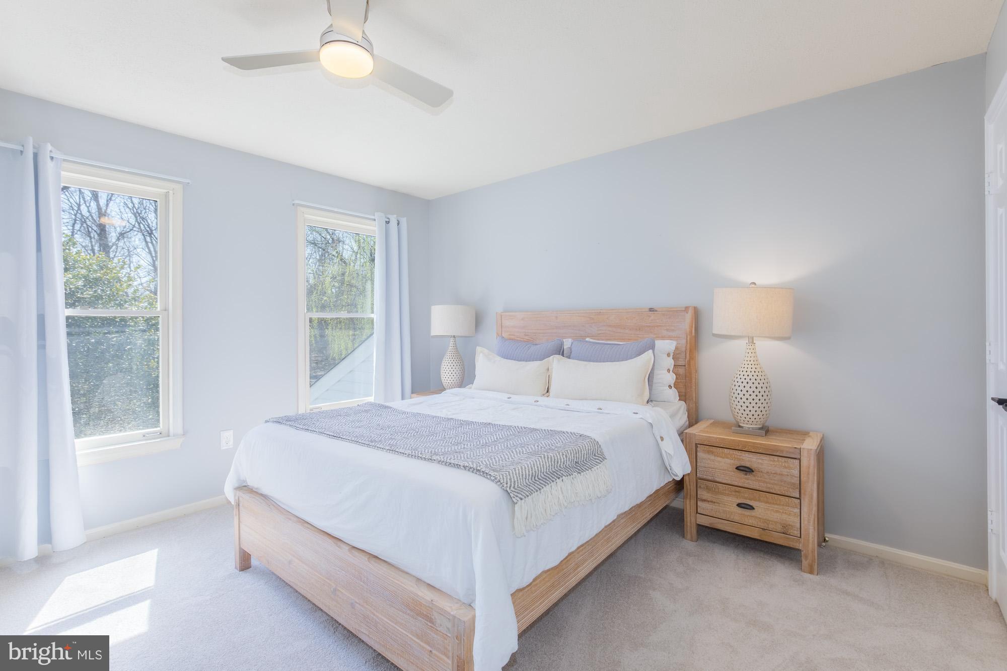 16217 Whitehaven Road Silver Spring, MD 20906 - Photo 36 of 50 a large bed sitting in a bedroom next to a window