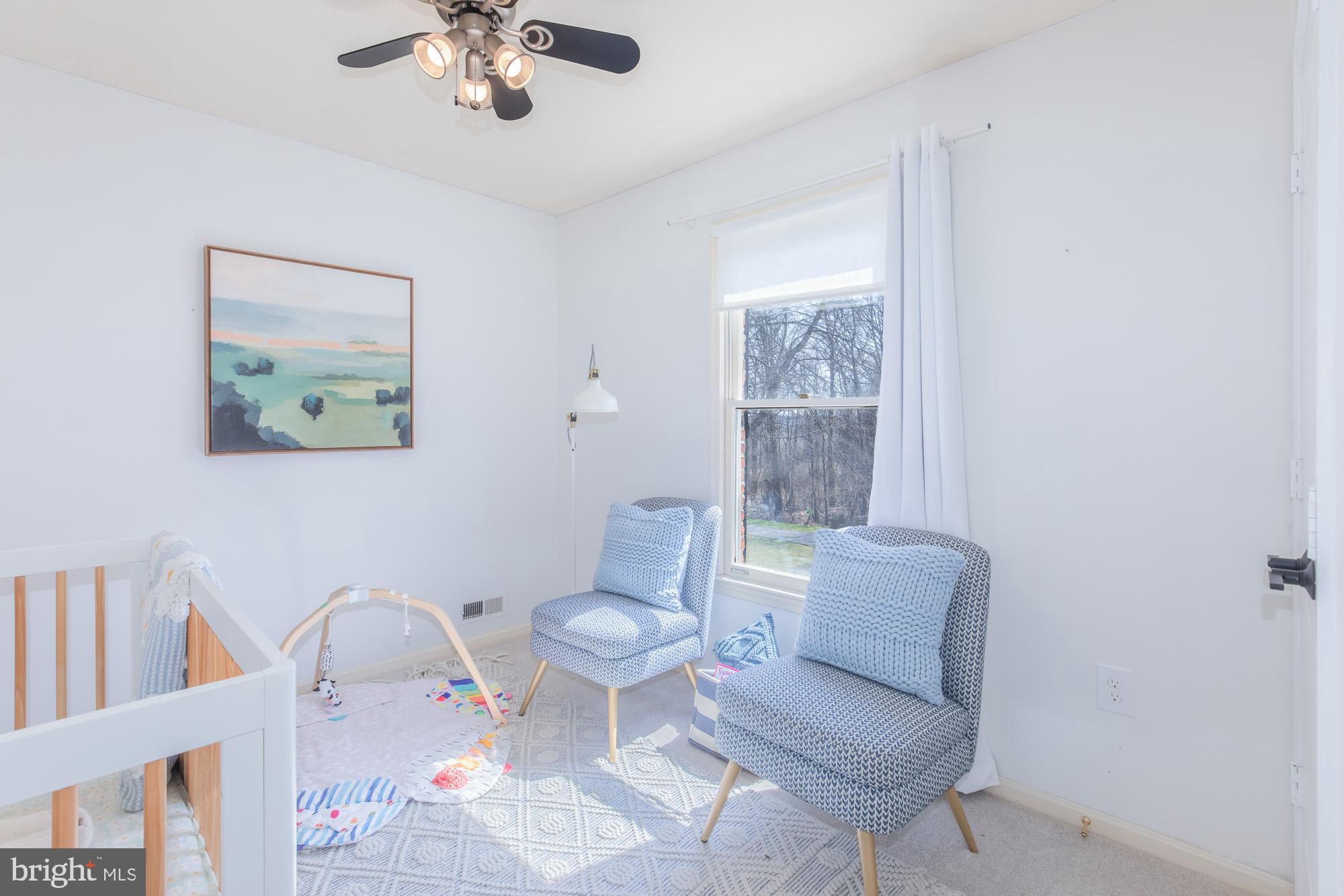 16217 Whitehaven Road Silver Spring, MD 20906 - Photo 37 of 50 a living room with furniture and a window