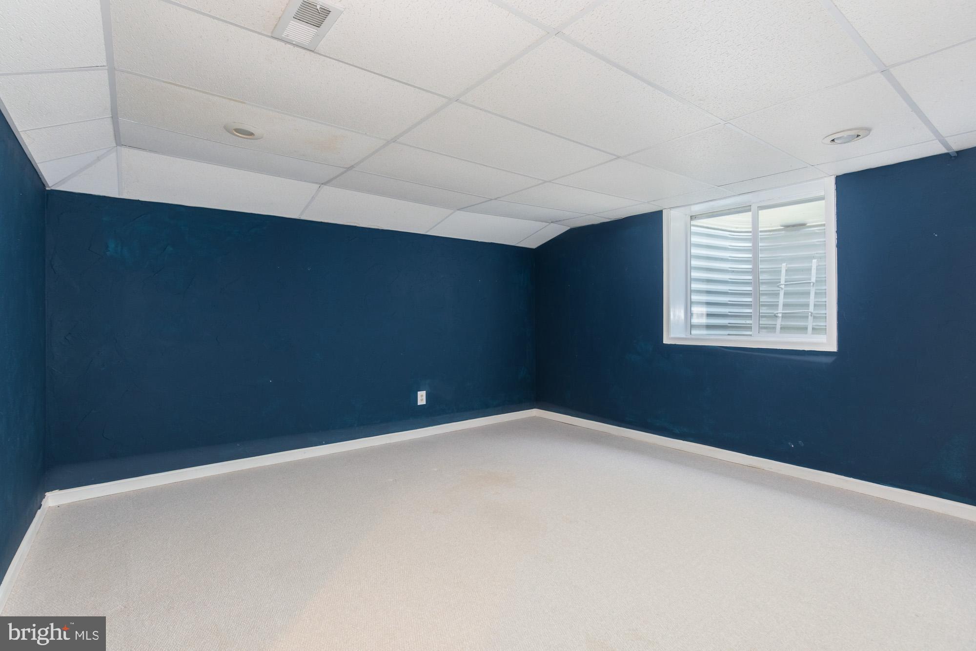 16217 Whitehaven Road Silver Spring, MD 20906 - Photo 43 of 50 a view of an empty room with a window