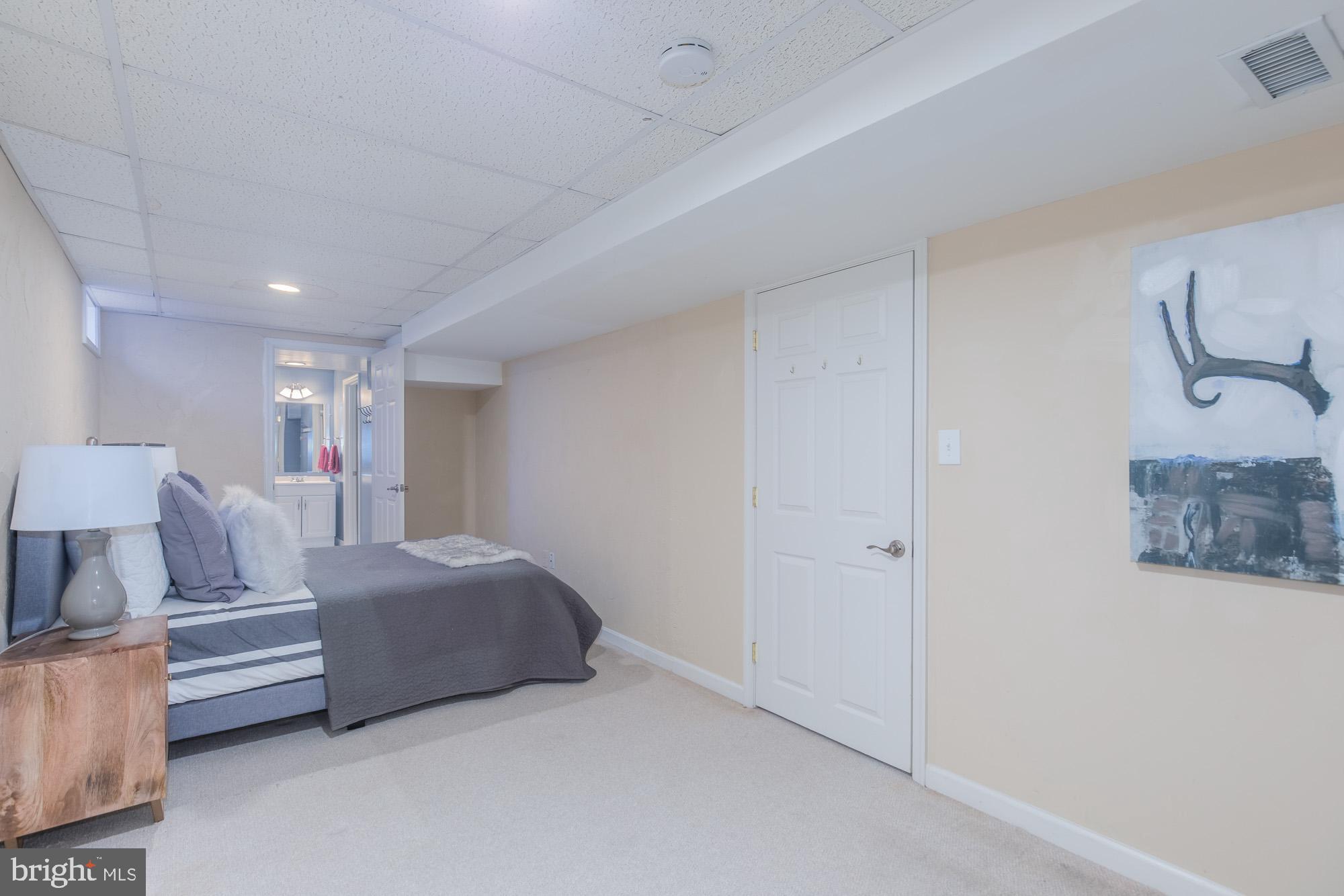 16217 Whitehaven Road Silver Spring, MD 20906 - Photo 44 of 50 a bedroom with a bed and a couch