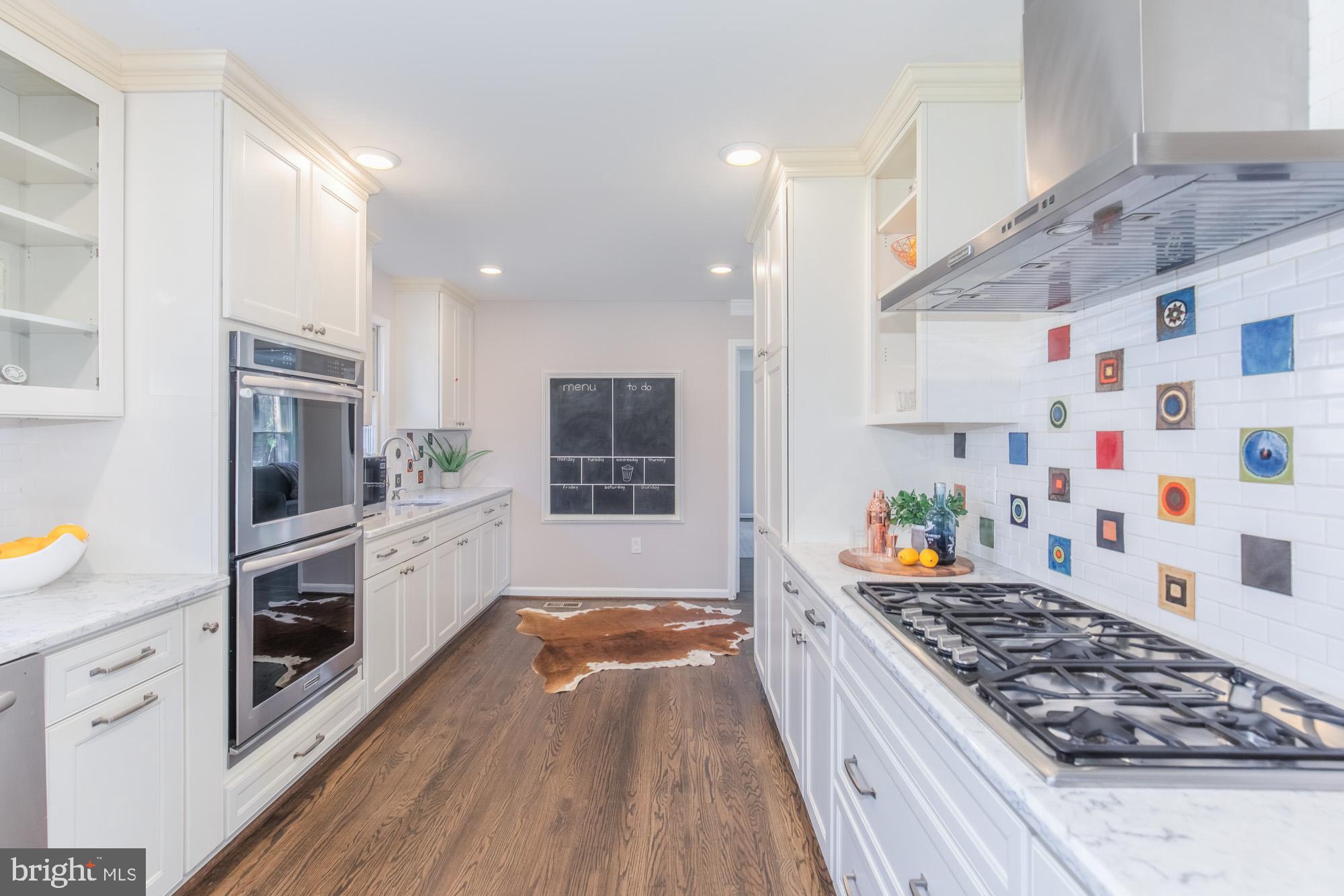 16217 Whitehaven Road Silver Spring, MD 20906 - Photo 9 of 50 a kitchen with stainless steel appliances granite countertop a stove and a sink