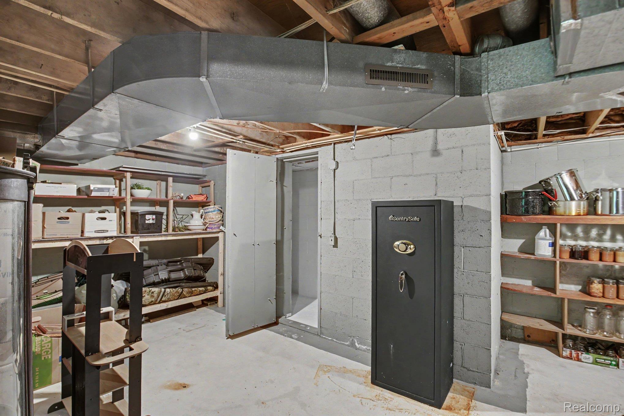1646 Boy Scout Road Caro, MI 48723 - Photo 19 of 28 Unfinished basement featuring concrete block walls and exposed ceiling joists