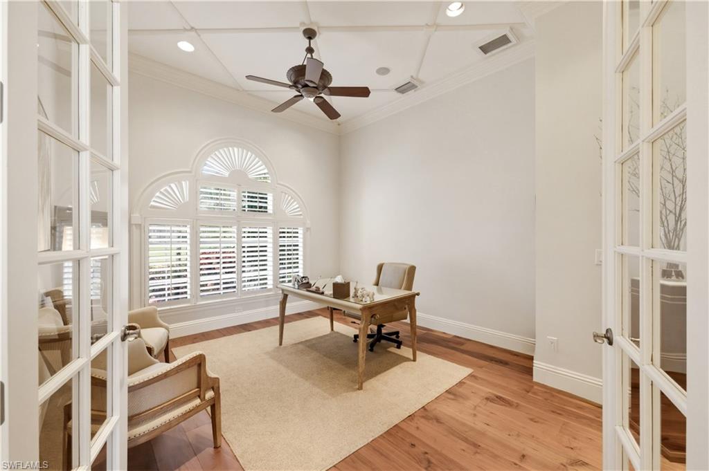361 Pirates Bight Naples, FL 34103 - Photo 17 of 45 a workspace with wooden floor and windows