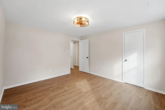 a view of an empty room and a window